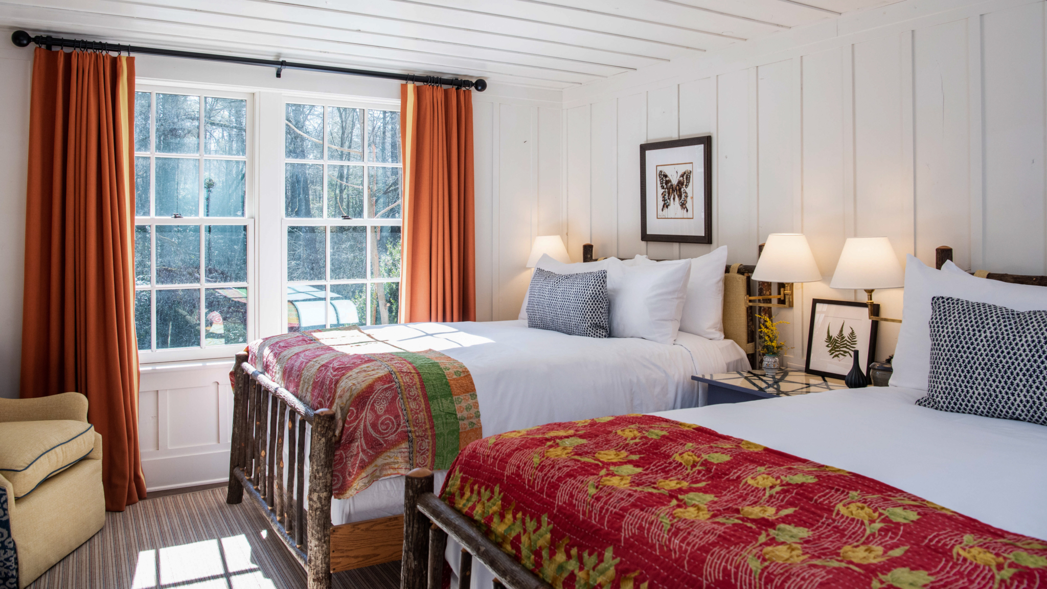 A welcoming Inn room with two queen beds and colorful bedding