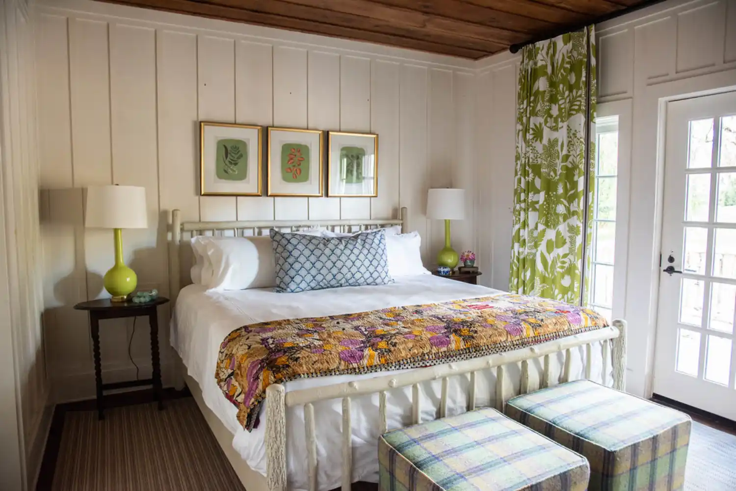 A warmly lit bedroom in the Lake Cottage