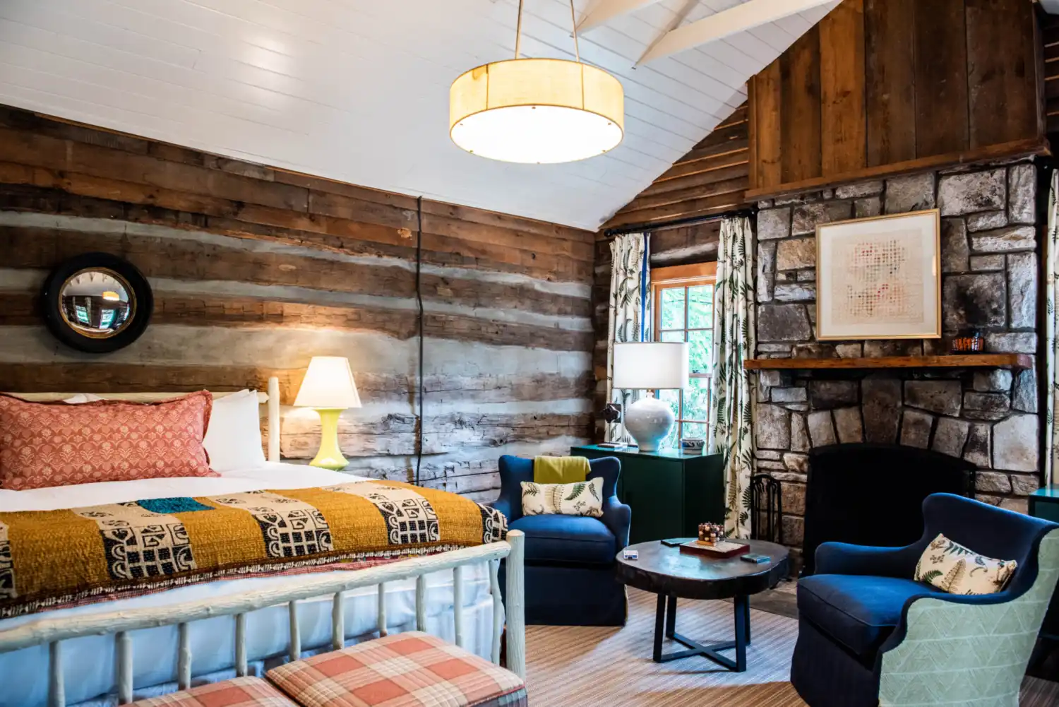 A bed and fireplace in Log Cabin