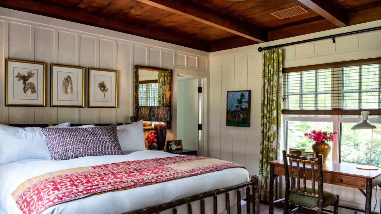 A cottage room with a king sized bed