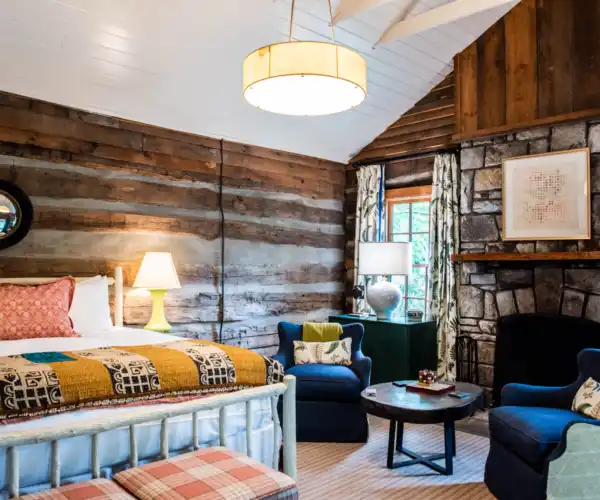 A bed and fireplace in Log Cabin