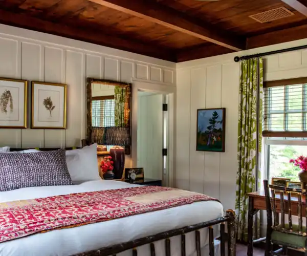 A cottage room with a king sized bed