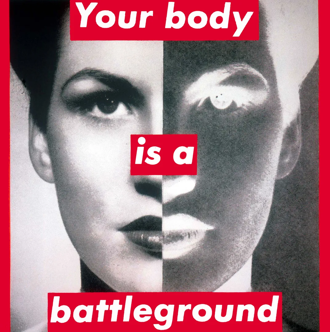 Barbara Kruger's bold white-on-red text over a black-and-white photo