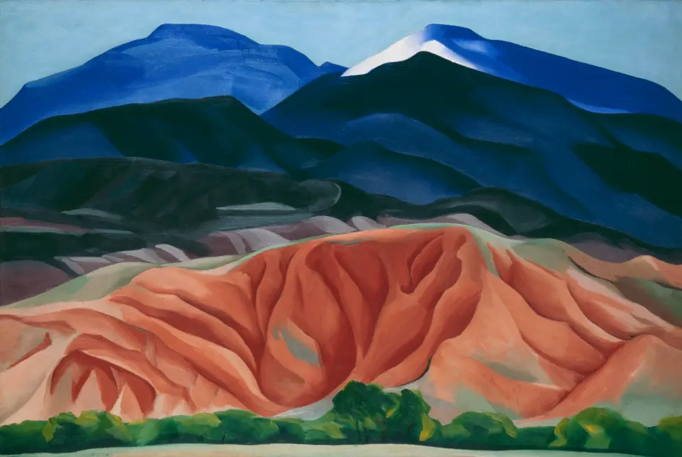 A Georgia O’Keeffe desert landscape with bold shapes, warm colors, and simplified forms that evoke the vastness of New Mexico.