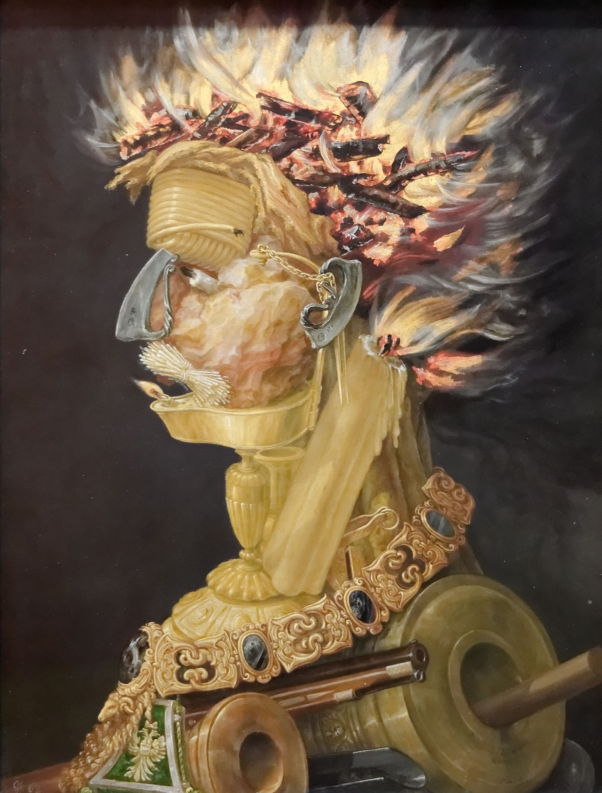 A blazing human figure composed of flames, torches, and weaponry—representing the element Fire.