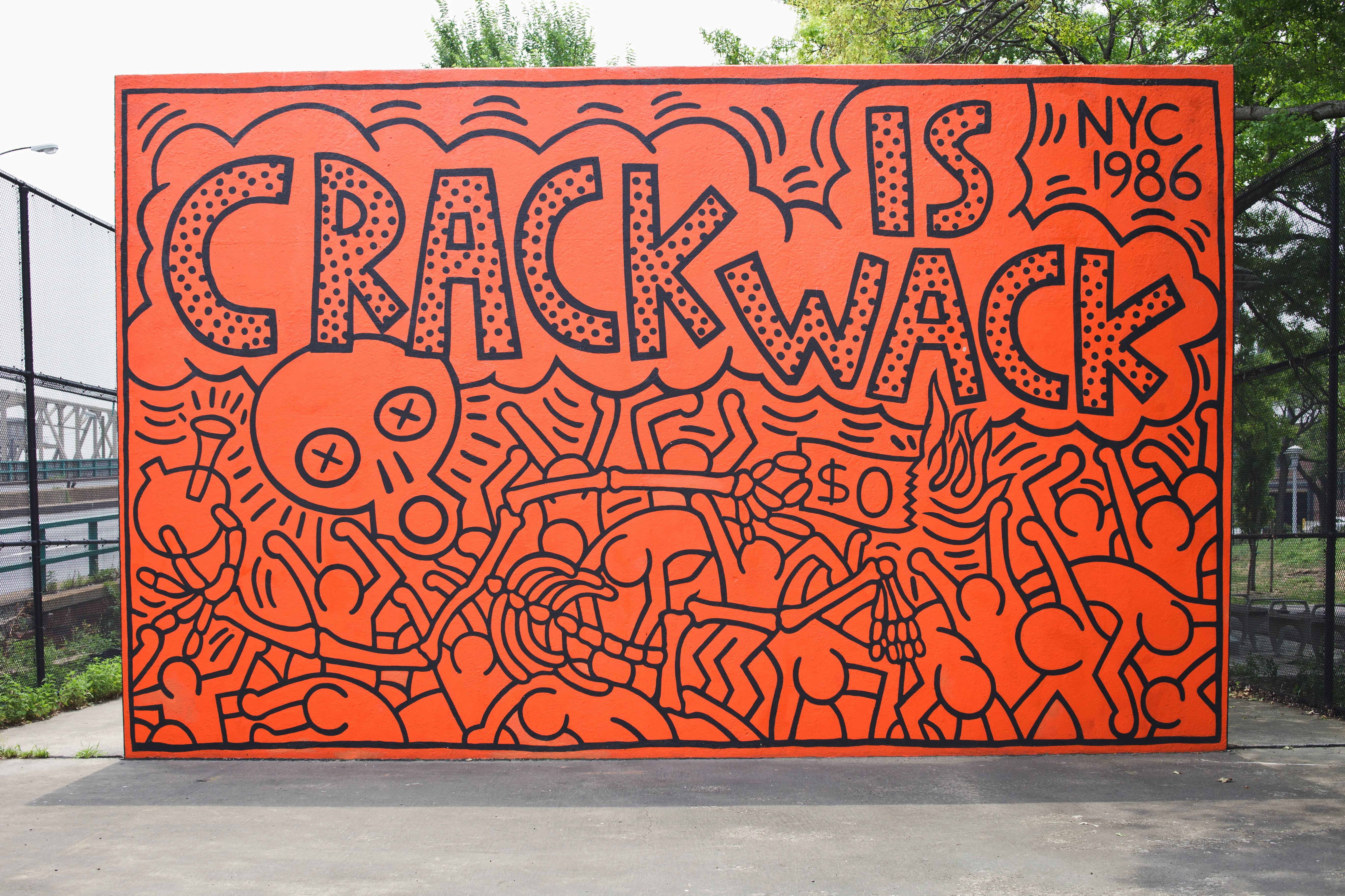 Crack is Wack mural with big orange background and black outlines, warning about the dangers of crack cocaine.