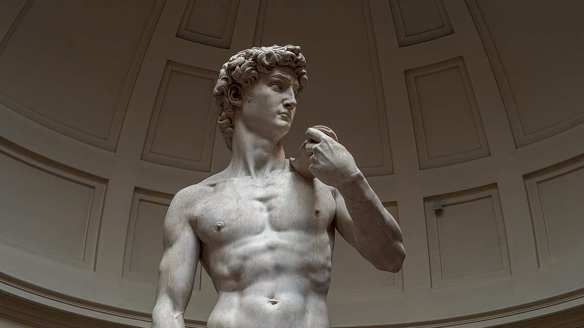 Michelangelo’s iconic sculpture of David stands as a symbol of Renaissance humanism, strength, and artistic perfection carved in marble.