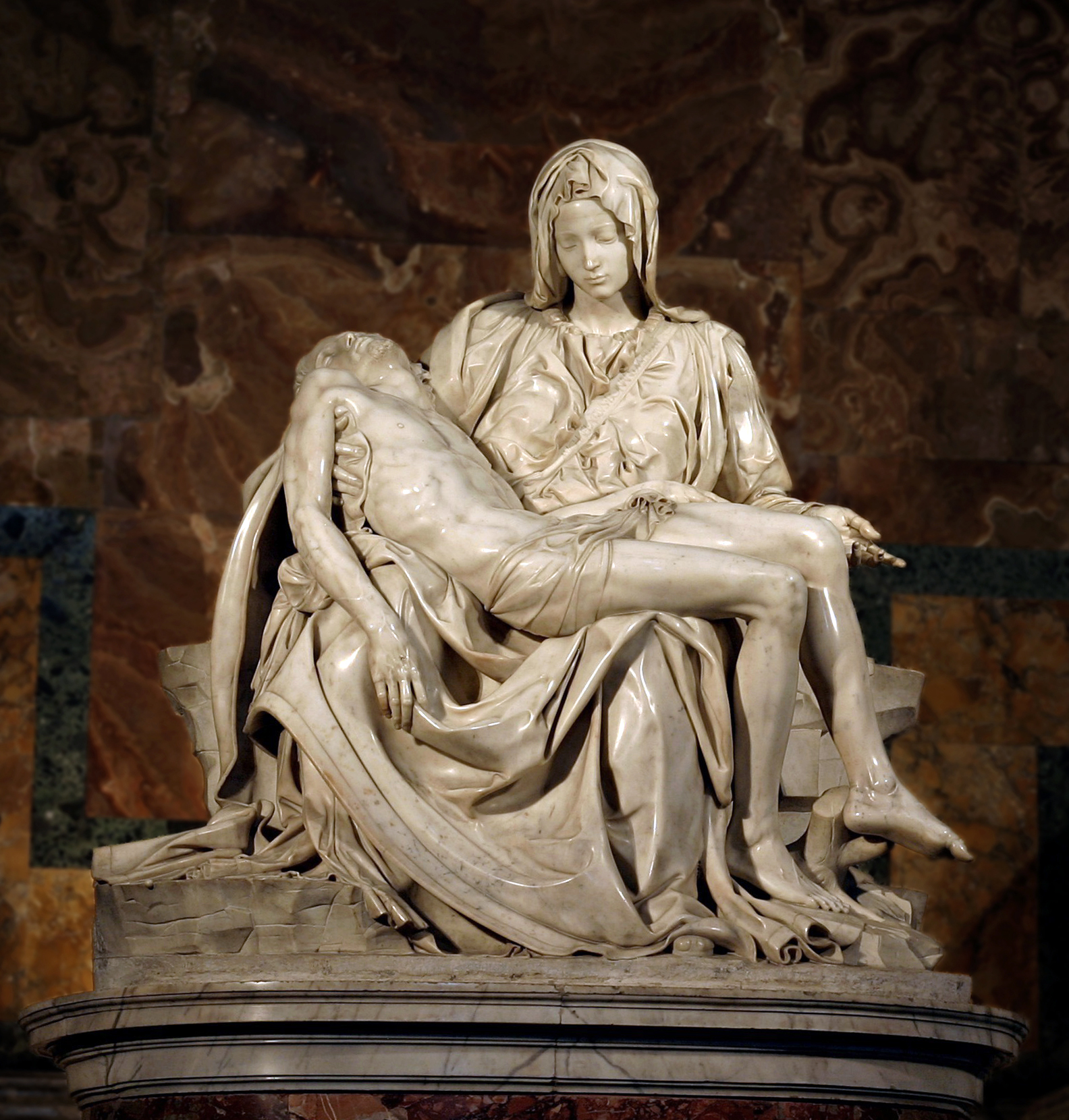 The Pietà by Michelangelo: the Virgin Mary holding the lifeless body of Jesus with stunning emotional and anatomical precision.
