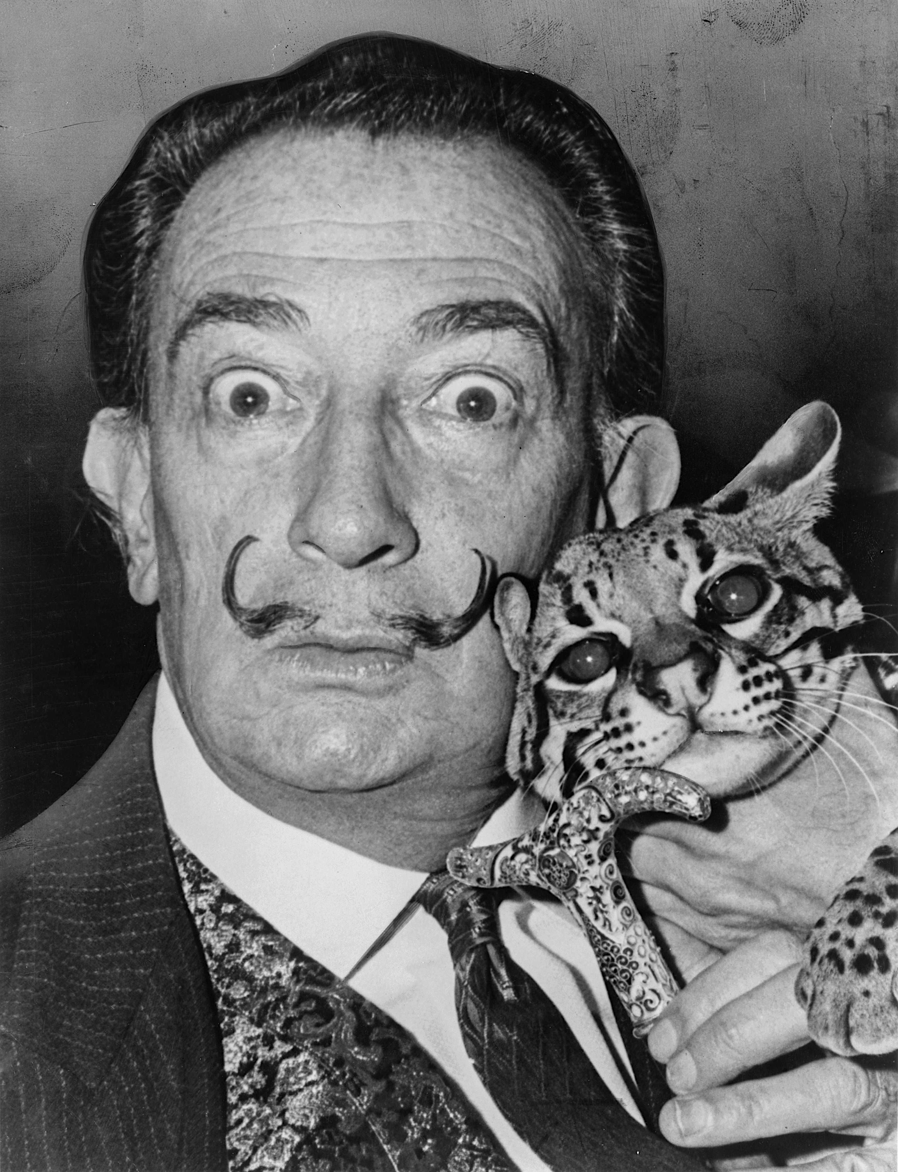 Salvador Dalí with his signature mustache and wild eyes—equal parts artist and surrealist showman.