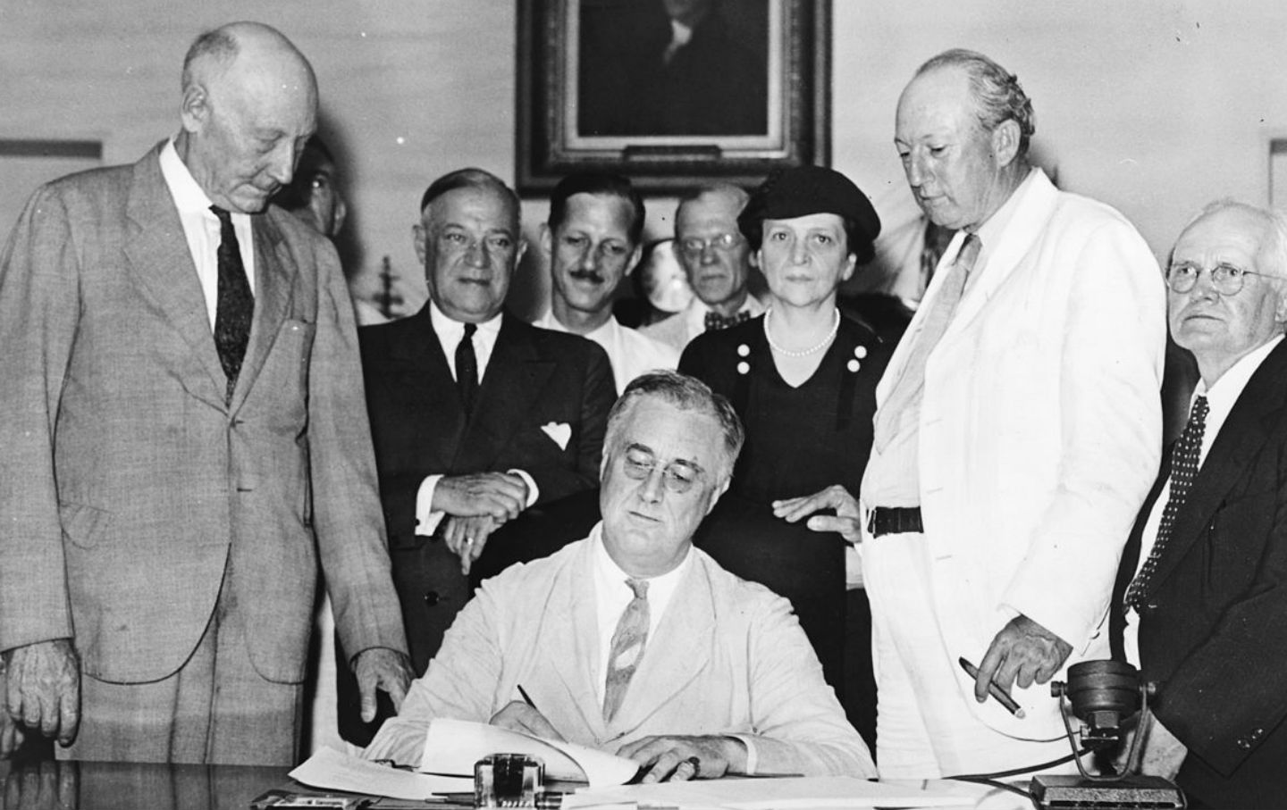 President Franklin D. Roosevelt signing the Social Security Act, August 14, 1935