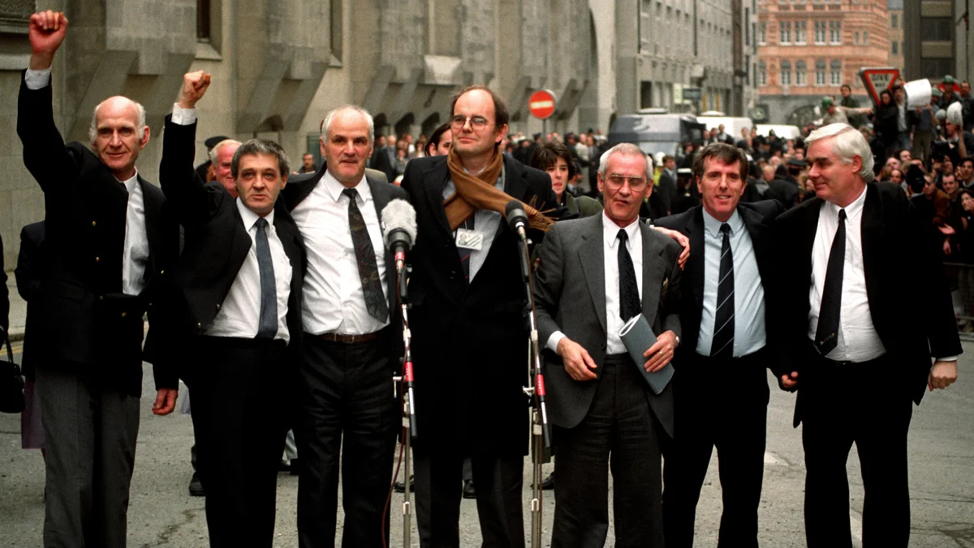 The Birmingham Six raising their hands after being released from prison in 1991.