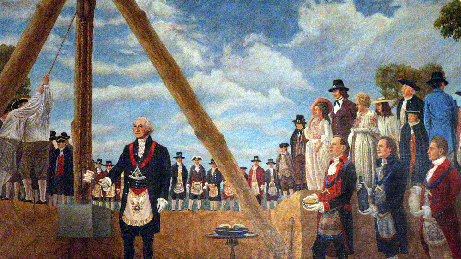 George Washington in ceremonial regalia placing the first stone of the U.S. Capitol building with onlookers gathered around.