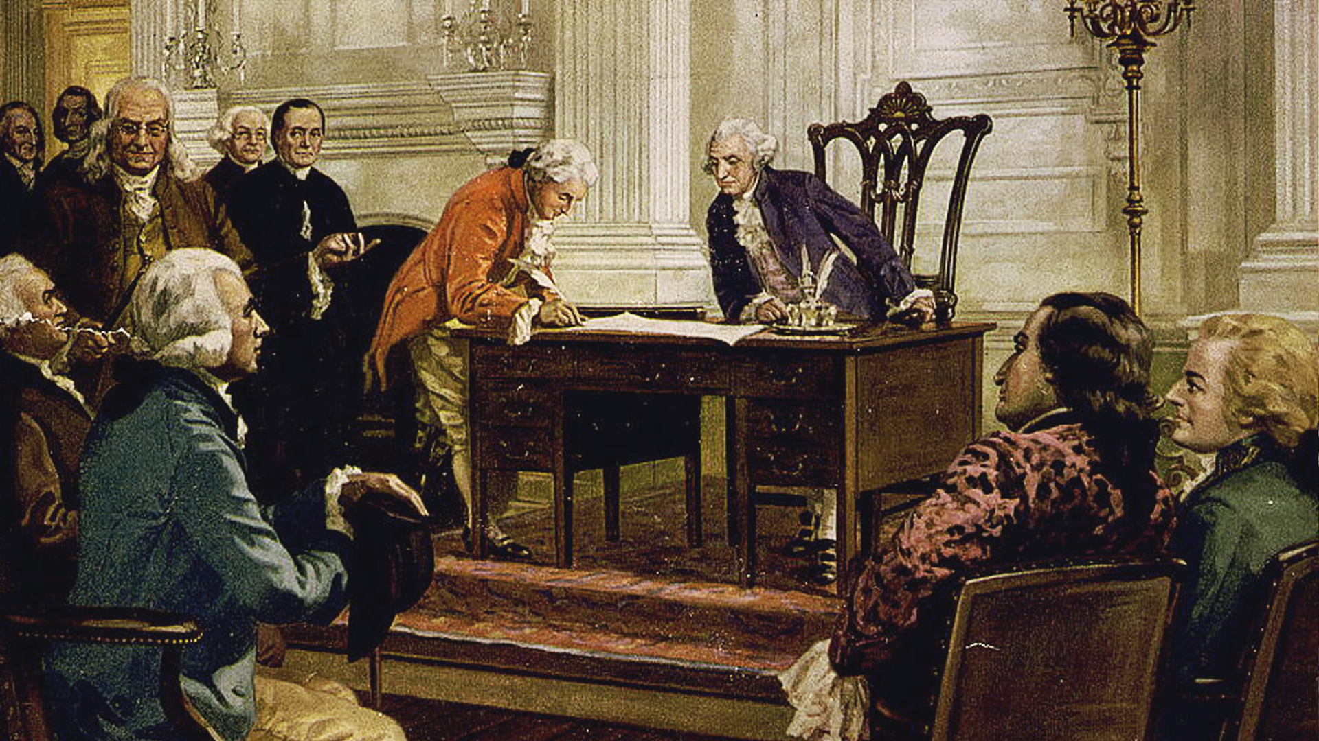Delegates in Independence Hall gathered around a table as George Washington presides over the signing of the Constitution.