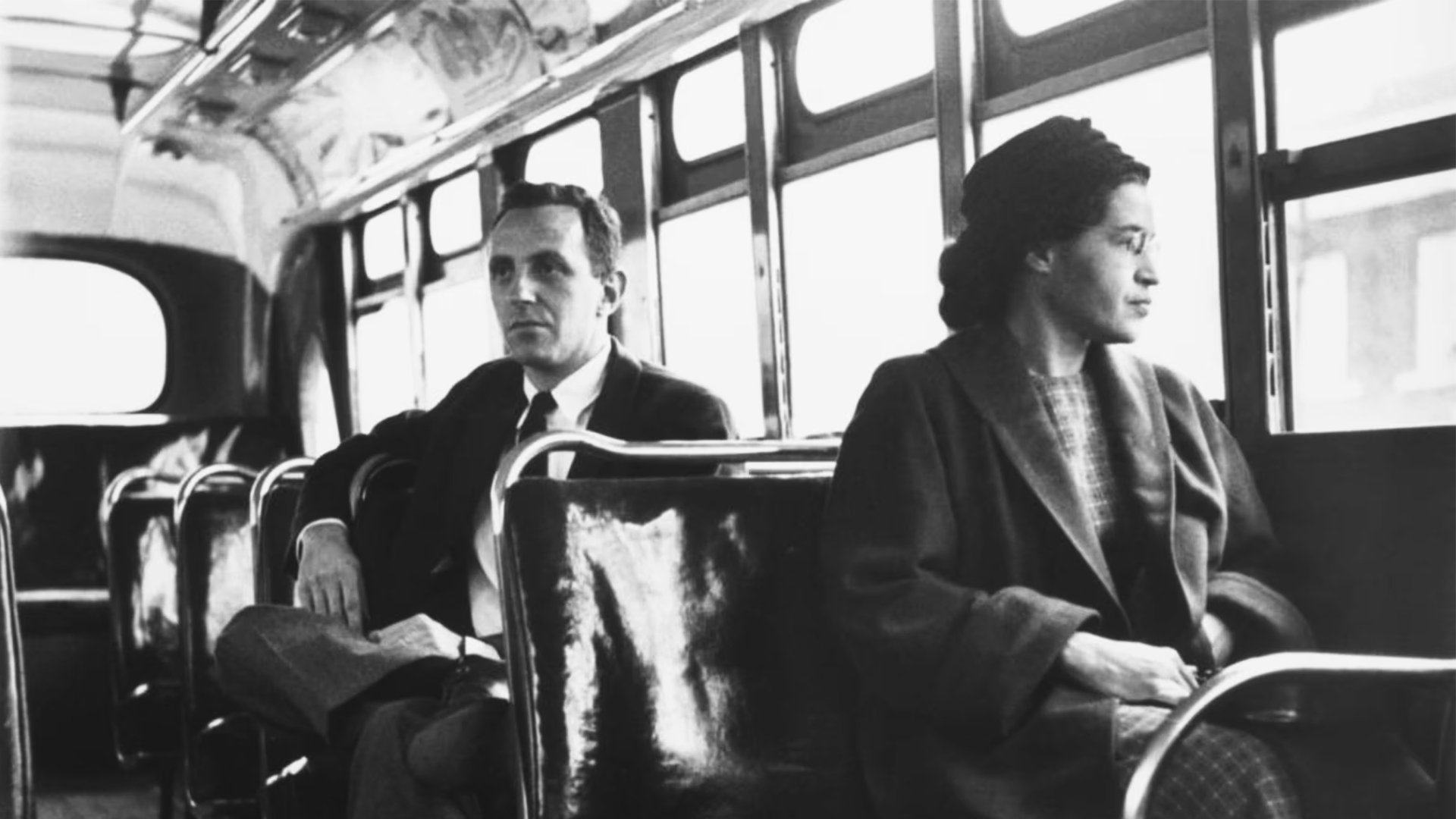 Rosa Parks sitting near the front of a Montgomery city bus after segregation was struck down