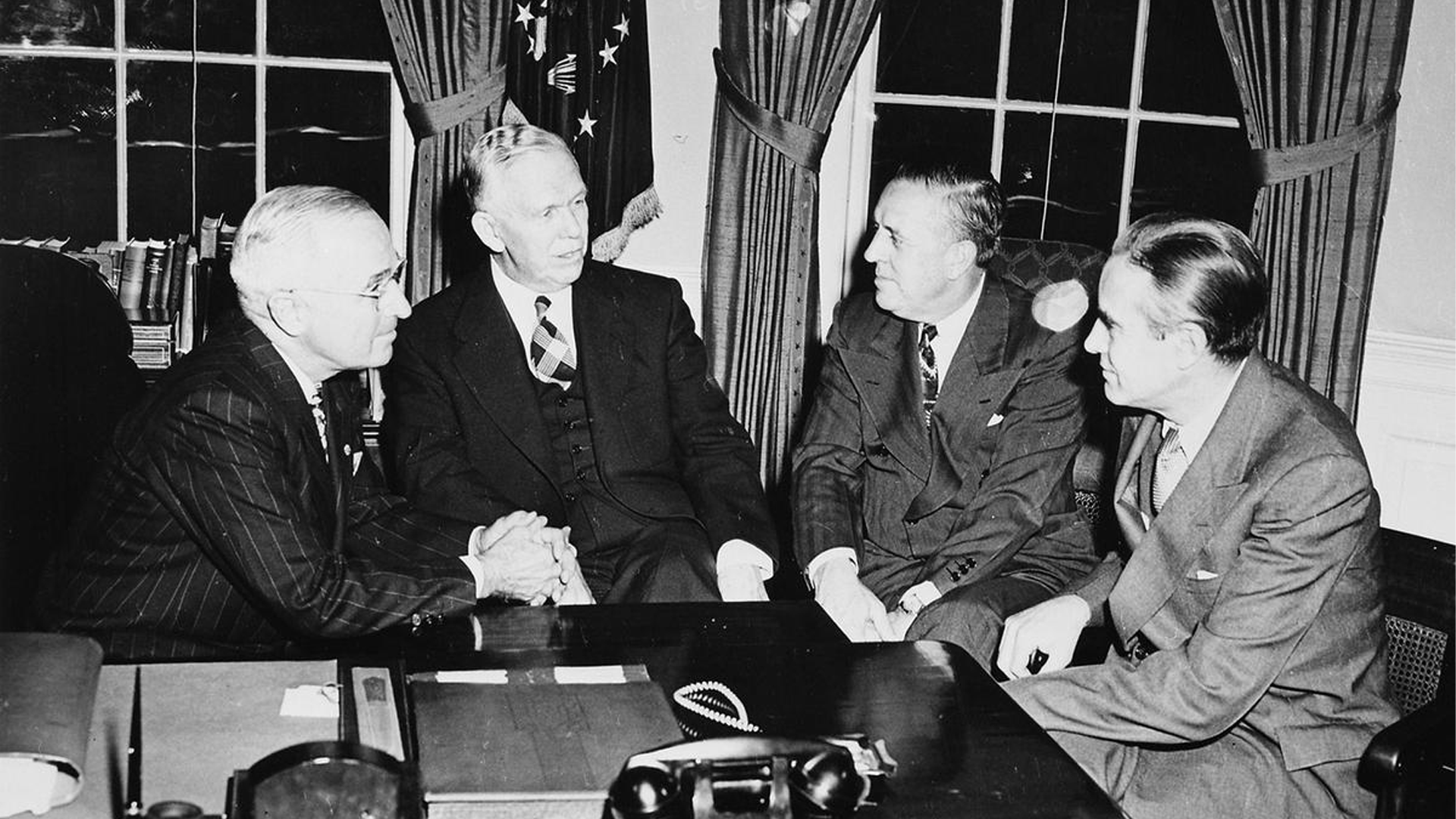 President Harry Truman signing the Marshall Plan to help rebuild Europe after World War II.