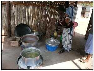 Woman cooking in a hut in South Sudan