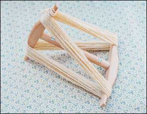 Niddy-noddy with yarn.