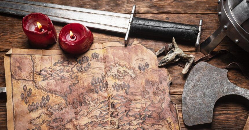 Treasure map of ancient lands. Ancient journey concept. Old map and battle axe on the wooden flat lay table background.