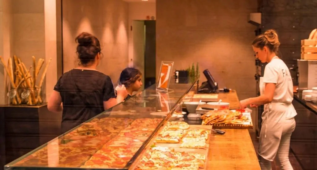 Immigrant customers in pizza place