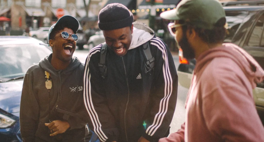 Black entrepreneurs laughing together on street