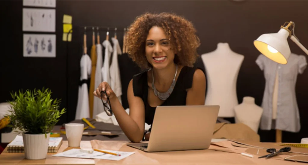 An entrepreneur looking into the camera in their office