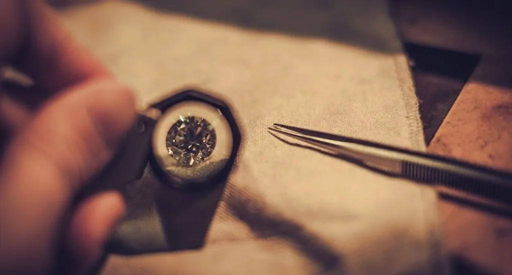 Jeweler inspecting lab-grown diamond