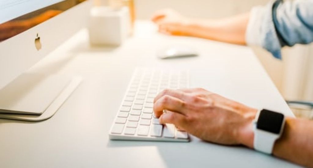 Entrepreneur typing keyword domains on computer