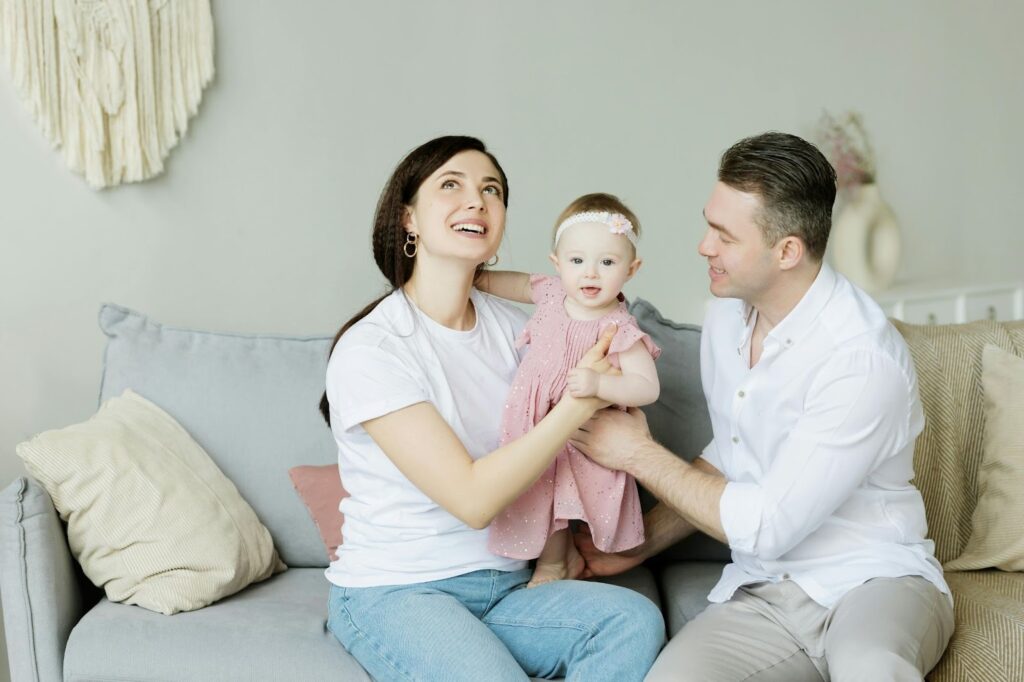 family sitting on couch