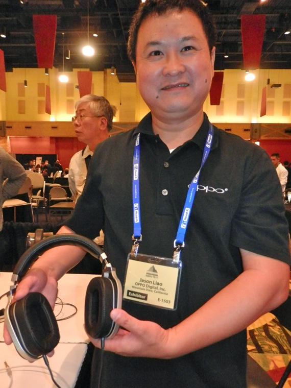Oppo Chief Technology Officer Jason Liao shows off his affordable PM-2 planar magnetic headphone, whose design leverages technologies delvelped for the firm's flagship PM-1 headphone