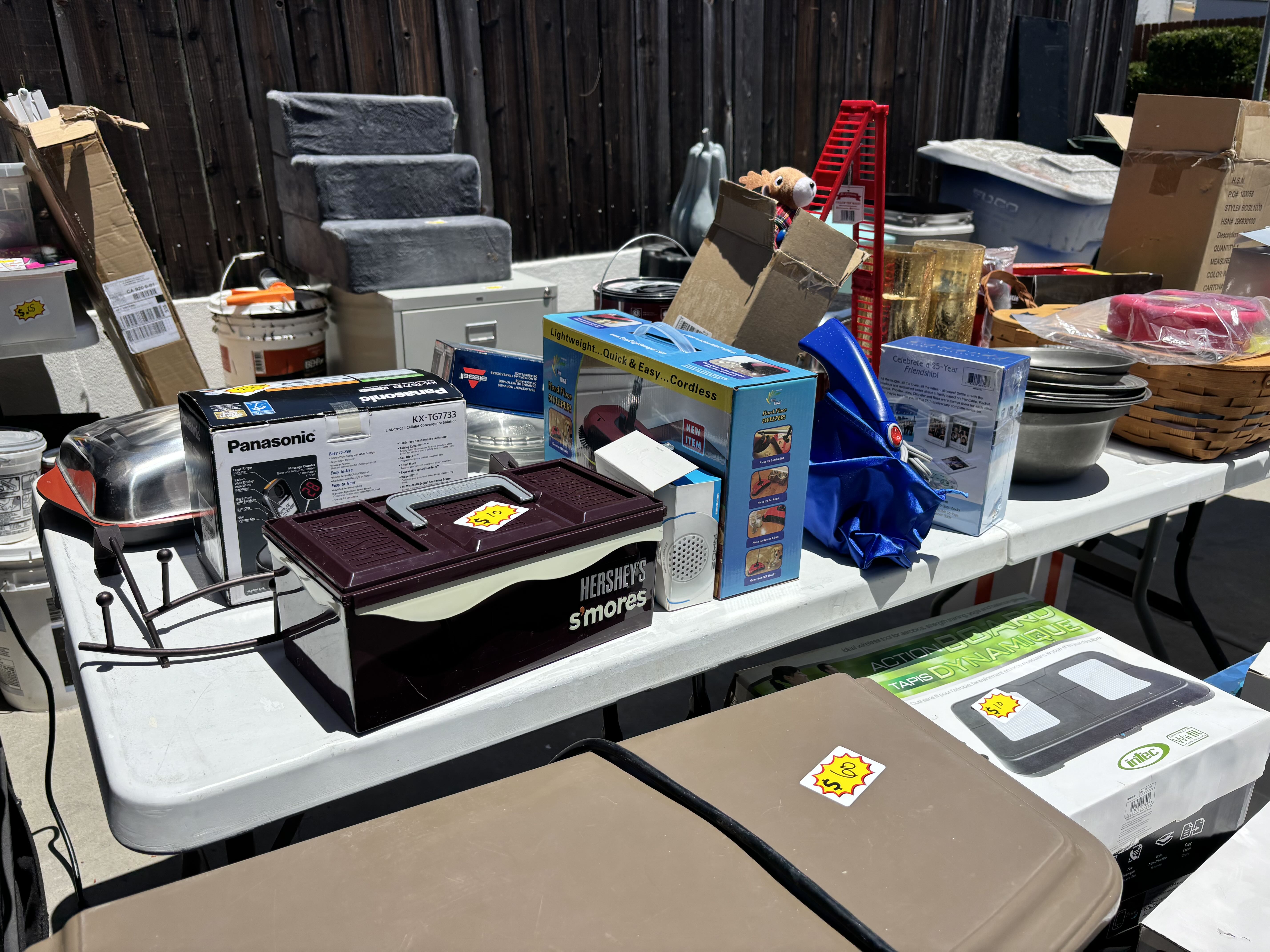 garage sale with video games, collectibles, new appliances, cookware photo