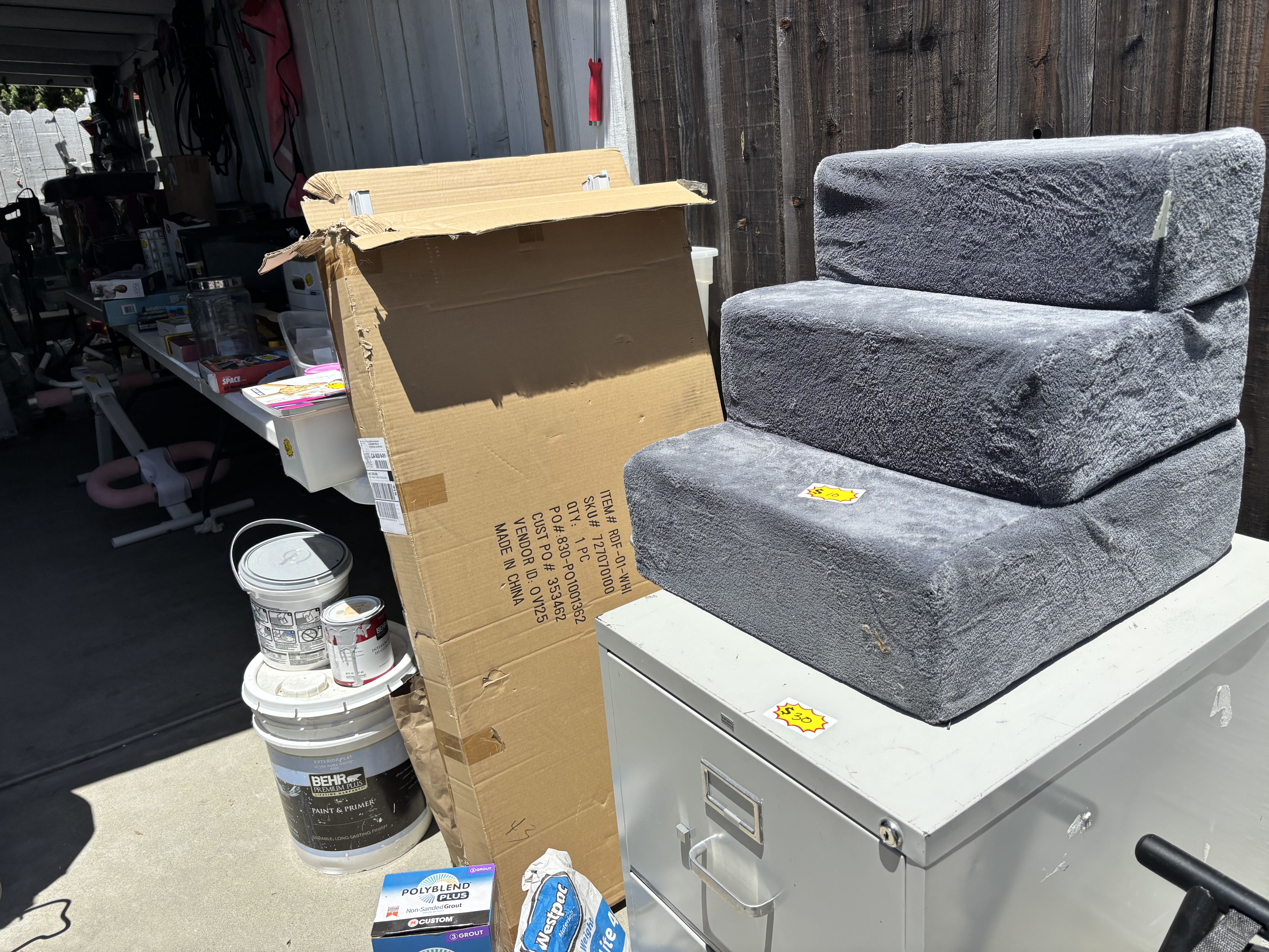 garage sale with video games, collectibles, new appliances, cookware photo