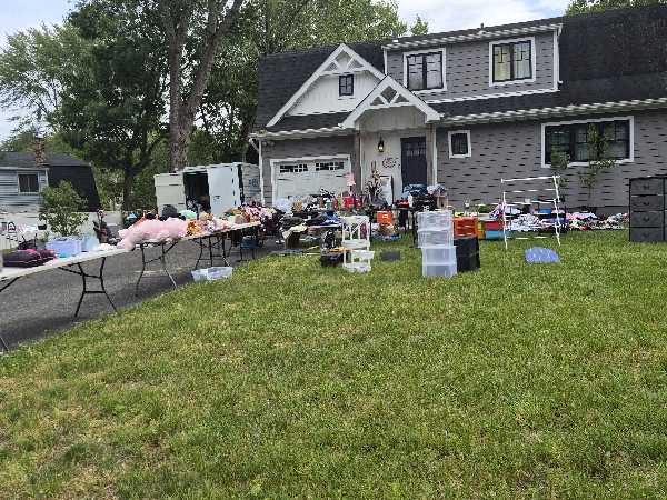 charity yard sale. lots of clothing and shoes some new, new and gently used toys, storage drawers kn photo