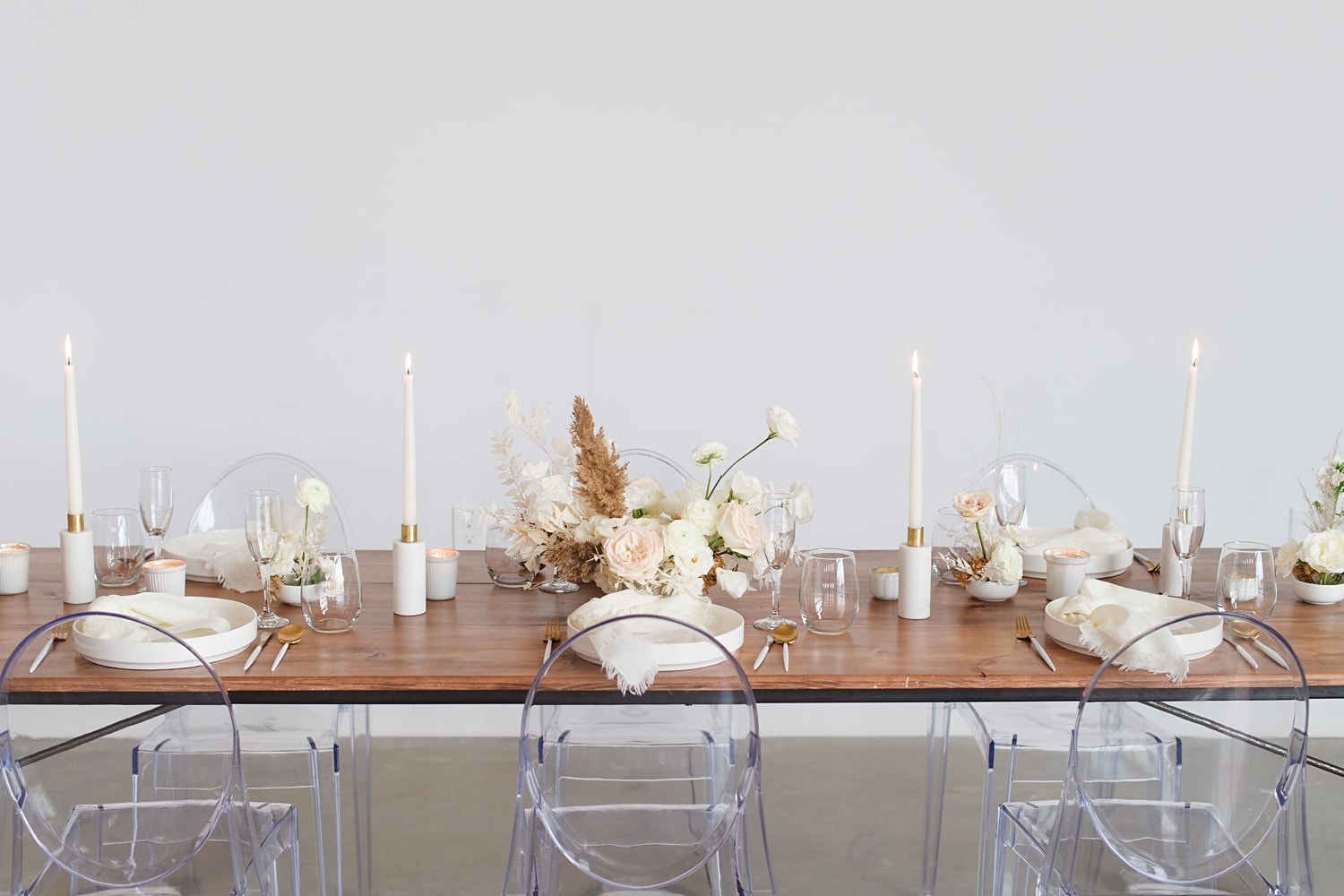 ghost chairs with mod boho white table setting