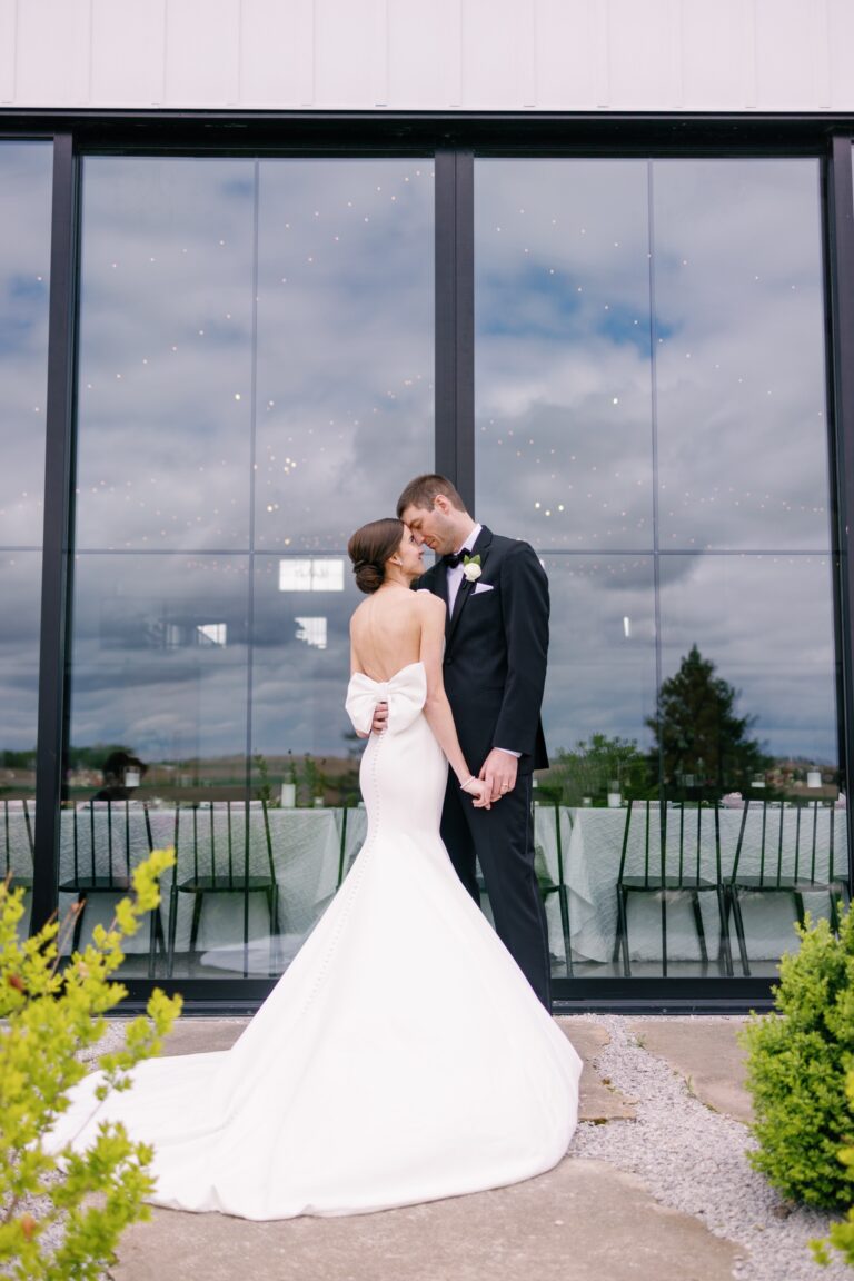 Bride and groom embrace for wedding photos at Little Light on the Lane in West Branch, Iowa