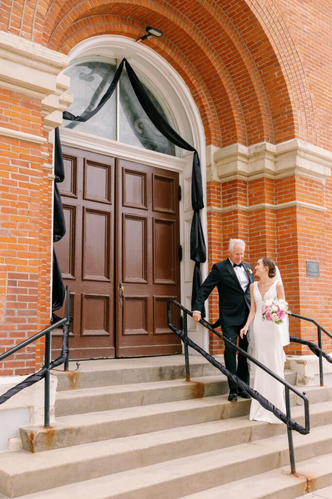 Bride gets ready for wedding ceremony at St Mary's in Iowa City