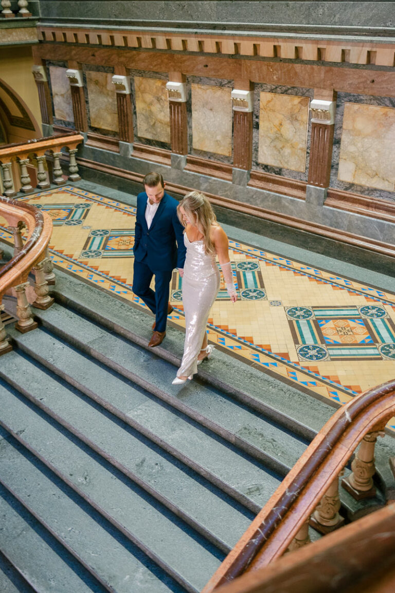 Des Moines Iowa Capitol engagement photos with champagne