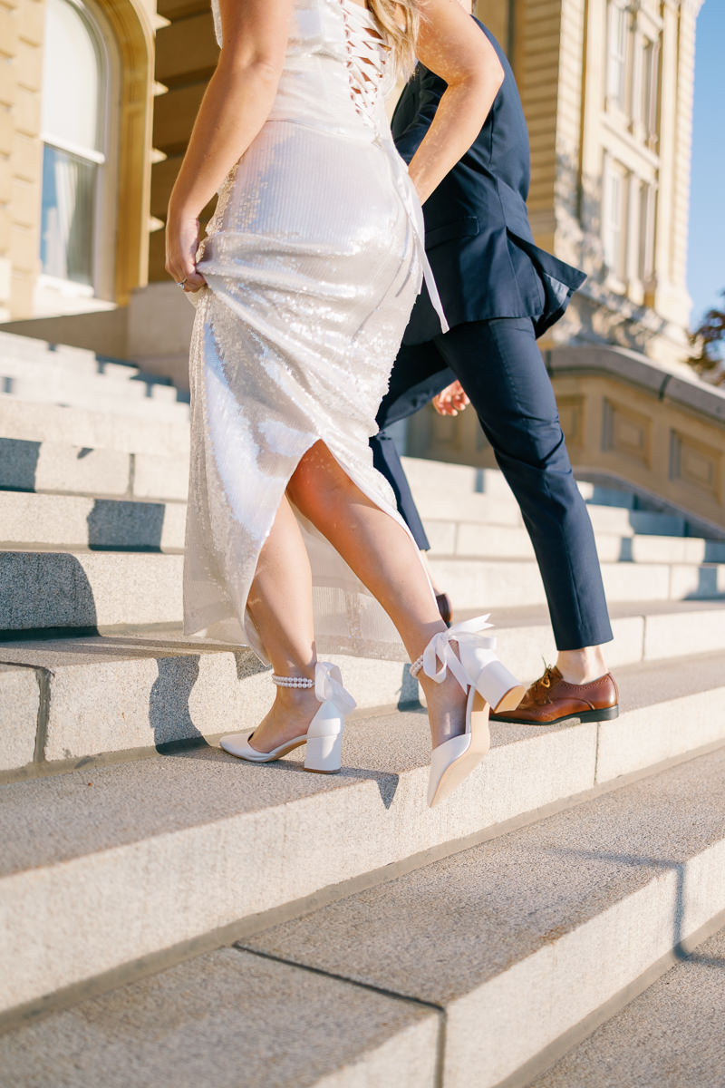 Des Moines capitol wedding photos sparkly dress and bow shoes