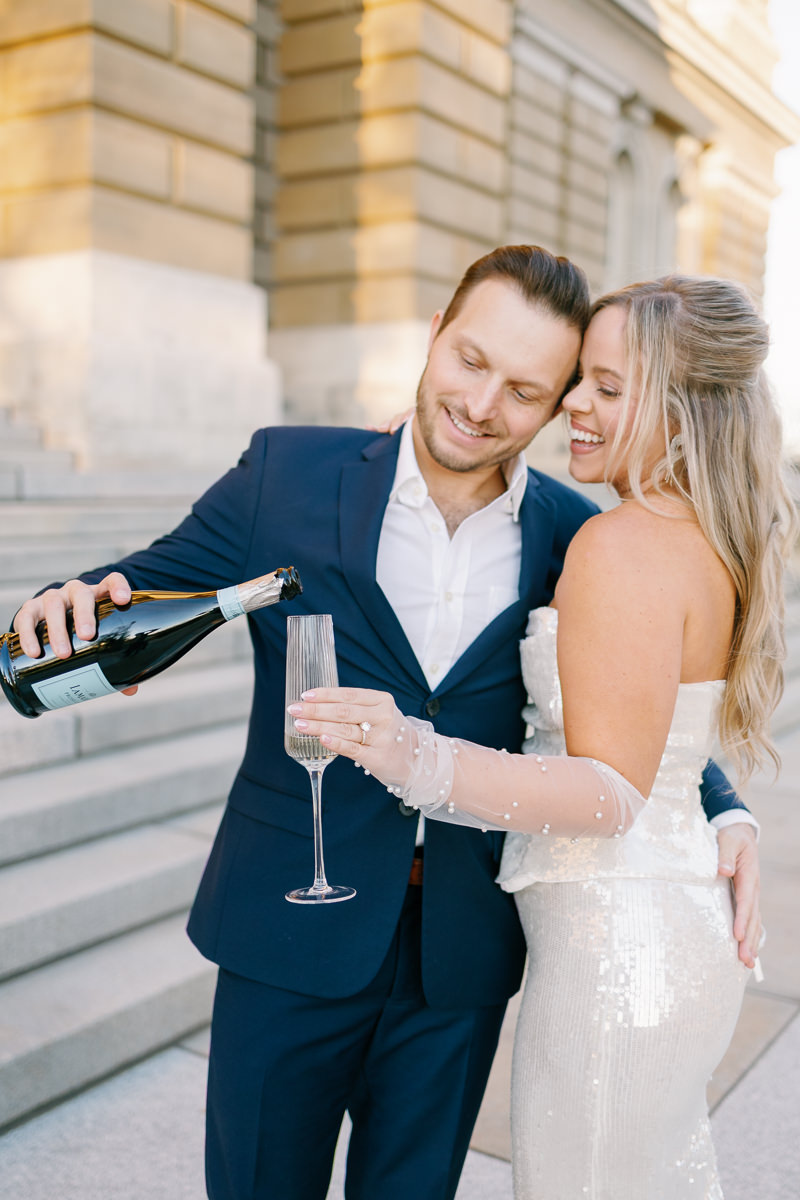 Des Moines capitol wedding photos with champagne