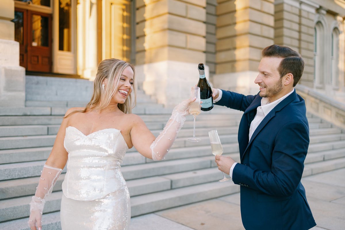 Des Moines capitol wedding photos with champagne