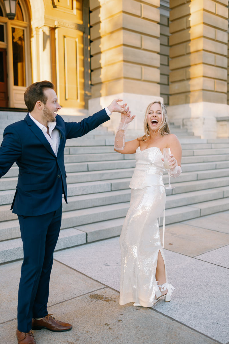 Des Moines capitol wedding photos with champagne