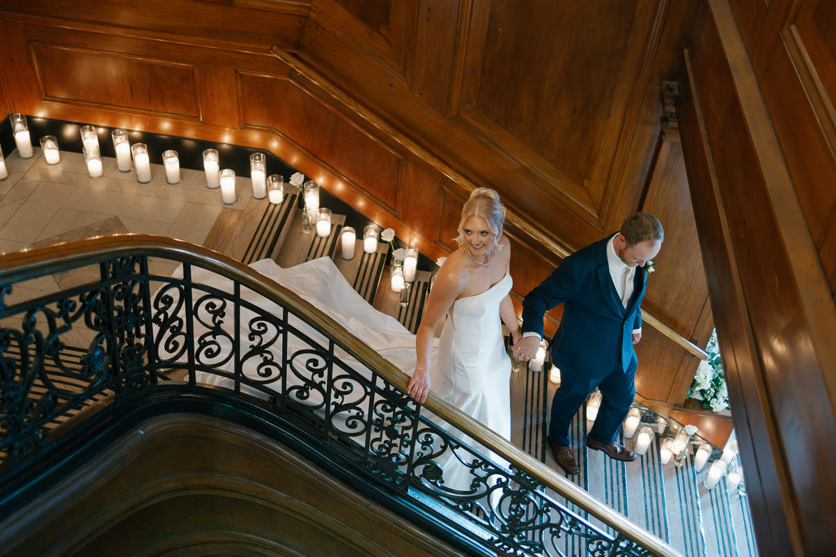 candlelit wedding photos at Hotel Fort Des Moines grand staircase