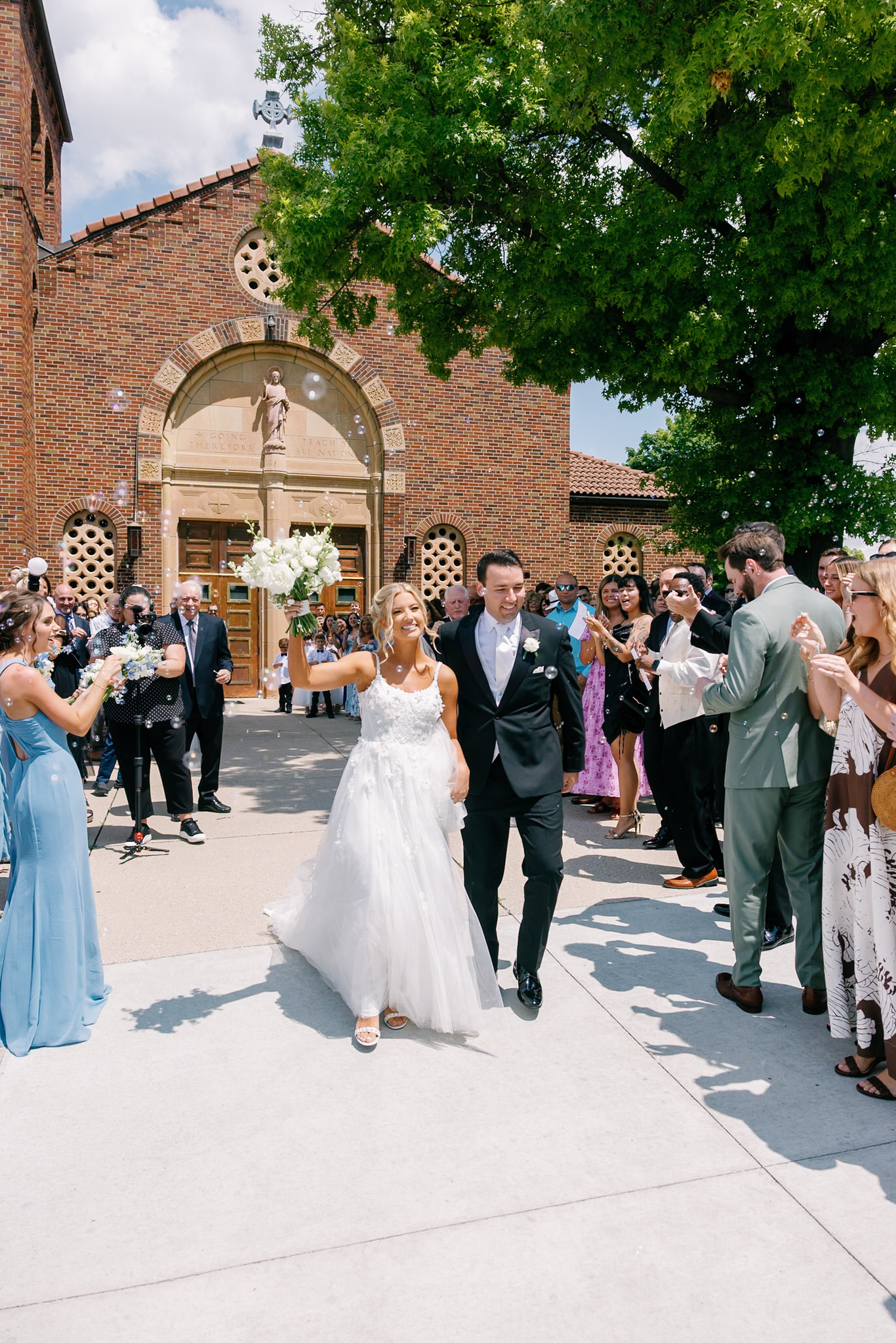 bride and groom exit the church after their ceremony