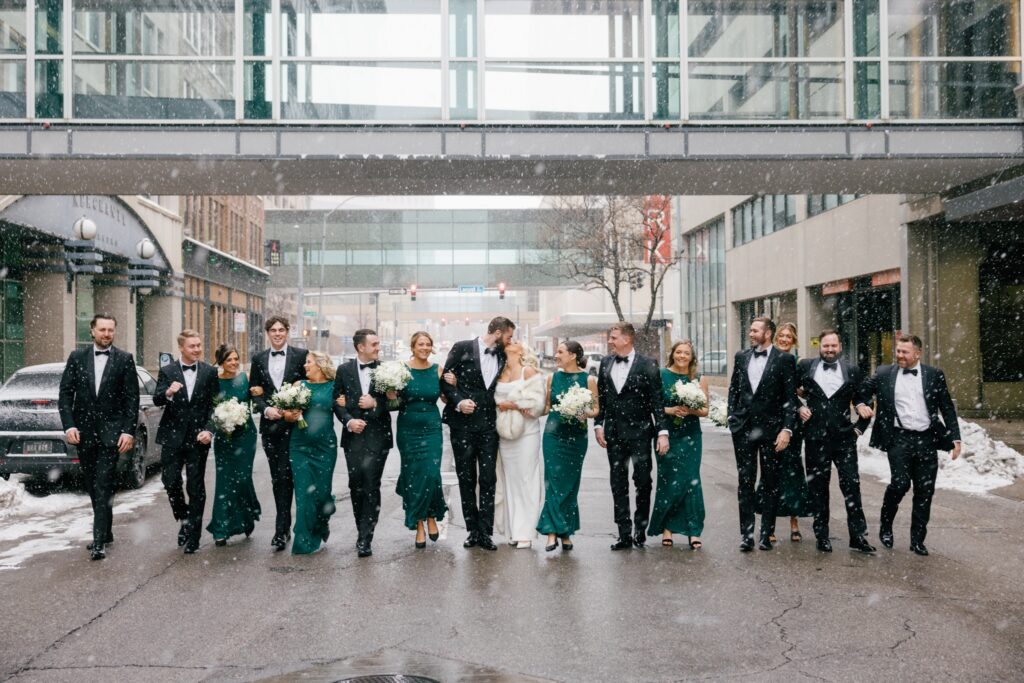 editorial fun walking photo of wedding party at Des Moines tea room