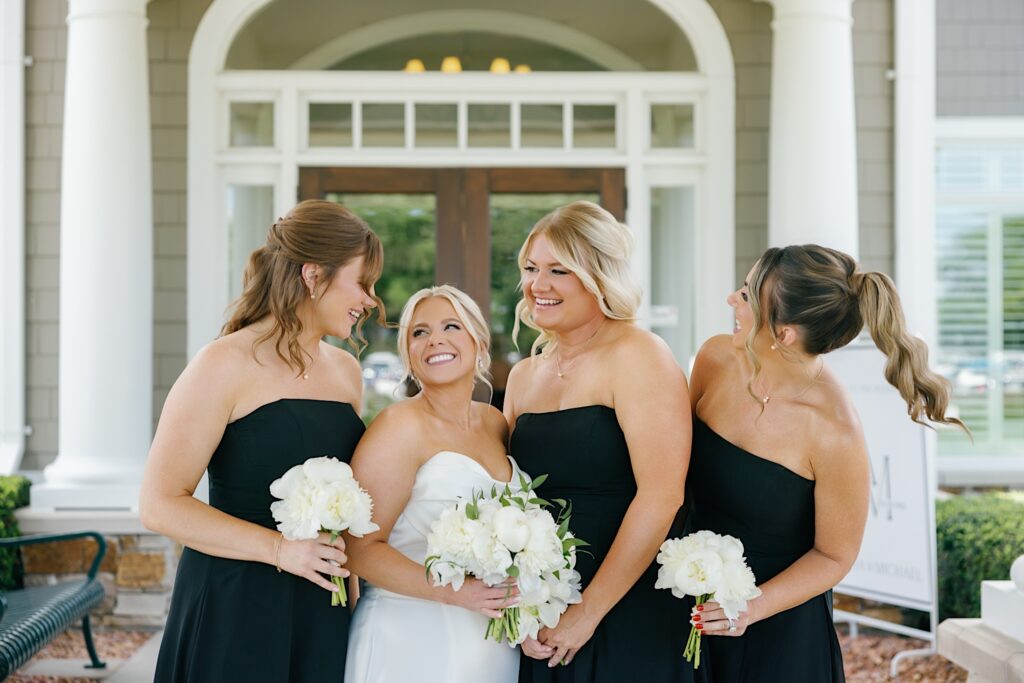 black bridesmaids dresses with white flowers