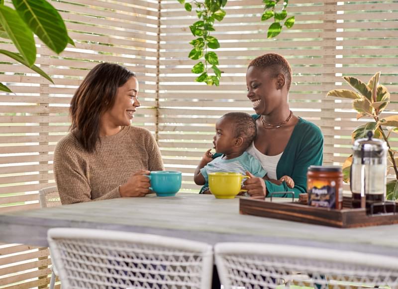 family drinking coffee around table