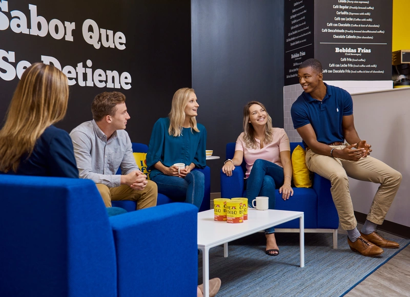 group of employees talking over coffee