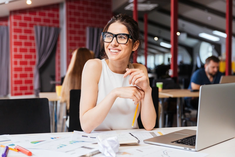 woman smiling at computer