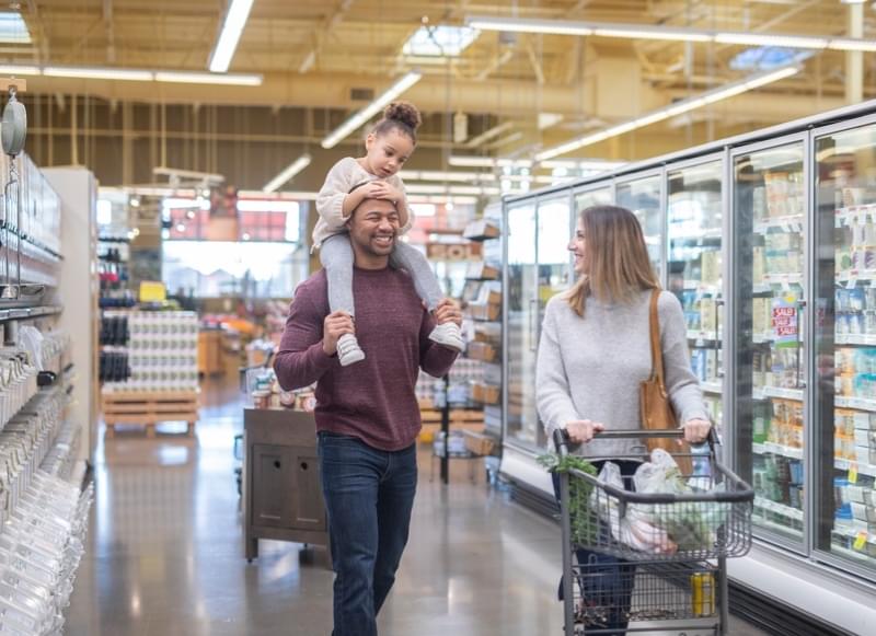 Couple with child at grocery store