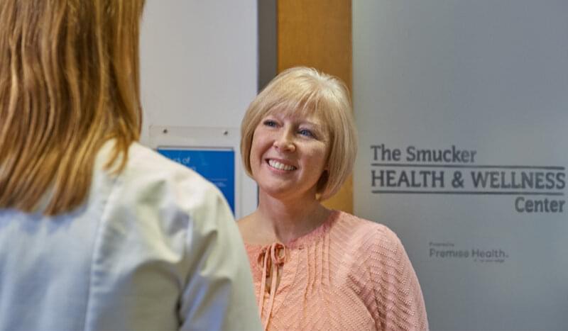 Woman smiling at Health and Wellness Center