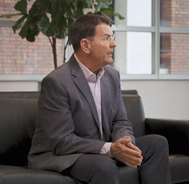 Man on couch talking